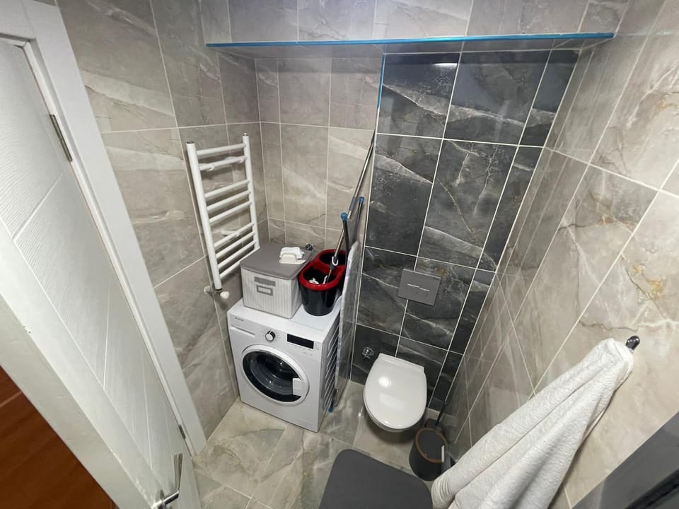 Shower, Toilet, Bathroom, towels, washing machine, dryer