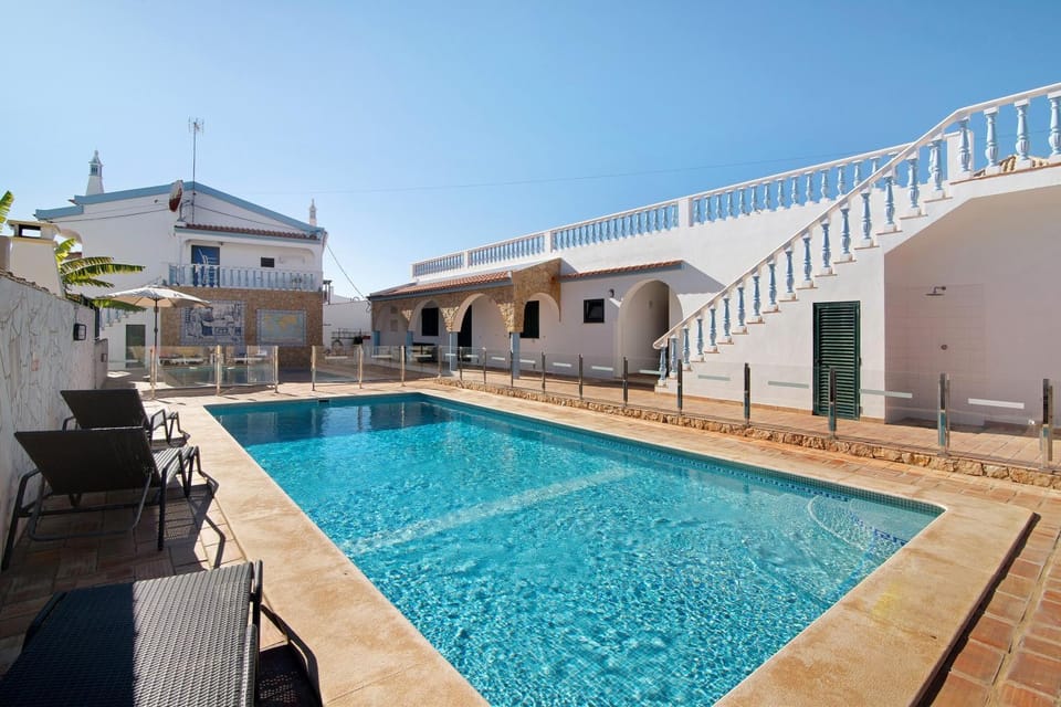 Property building, Living room, Swimming pool