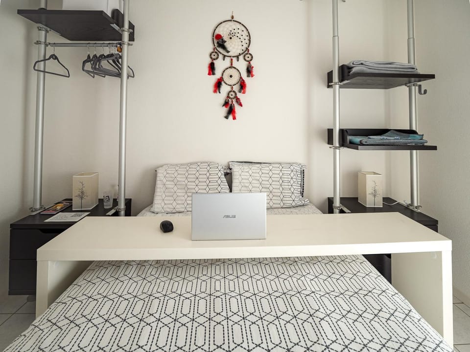 Bed, Seating area, Bedroom, hair dresser, storage, towels