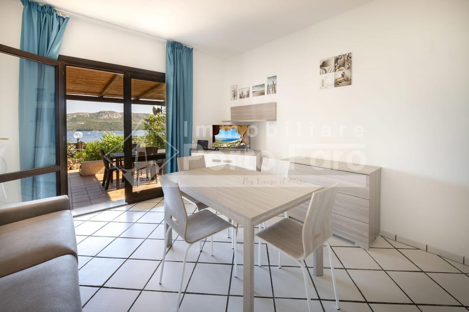 2B - Porto Mannu appartamento a pochi passi dalla spiaggia Villa in Sardinia