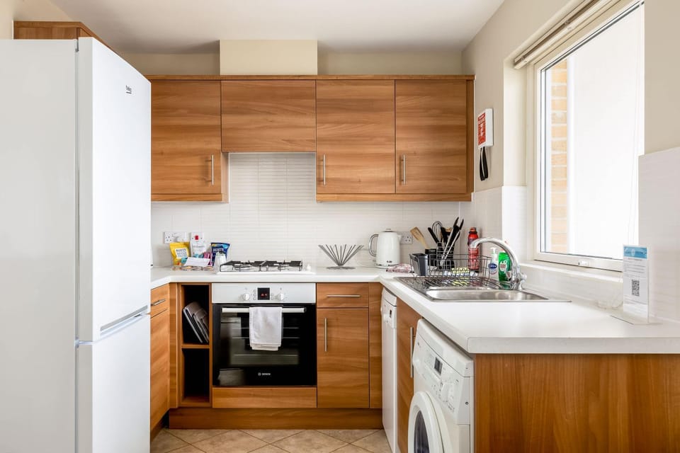 Kitchen or kitchenette, dishwasher, oven, stove, washing machine, dryer