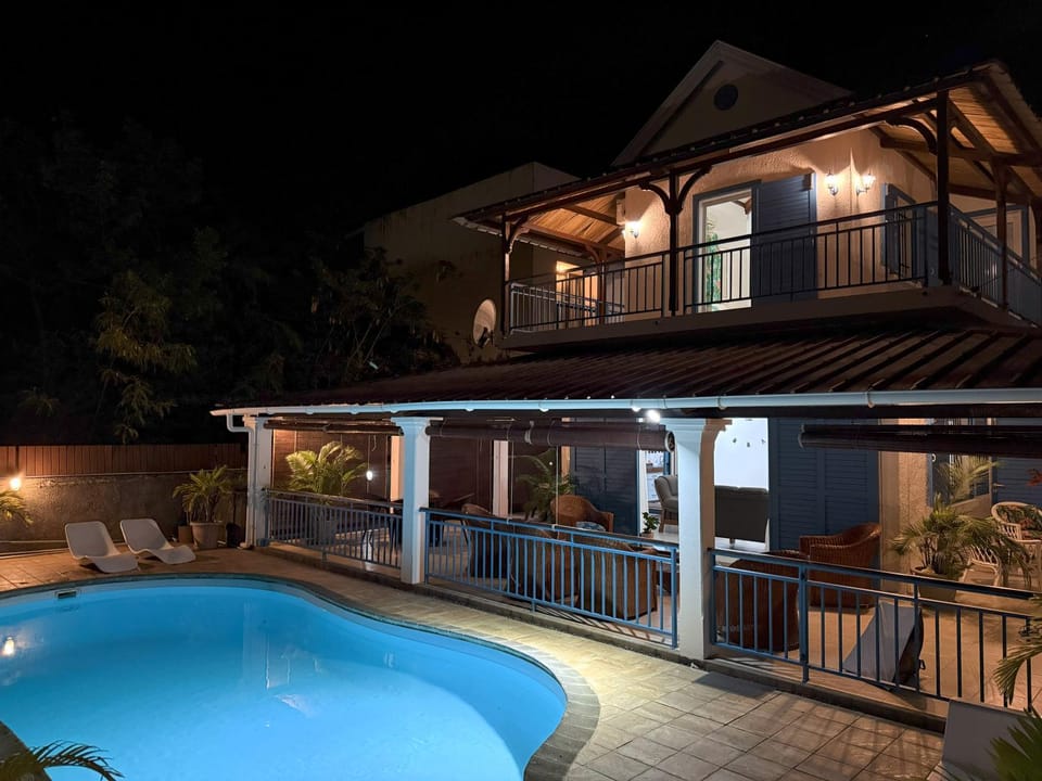 Property building, Patio, Night, Balcony/Terrace, Pool view, Swimming pool