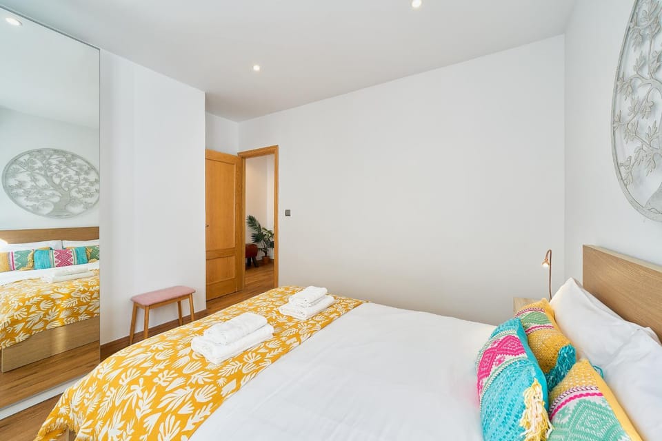 Bed, towels, wardrobe