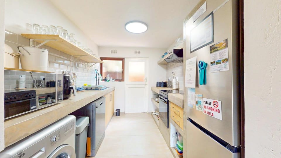Kitchen or kitchenette, dishwasher, oven, stove, washing machine