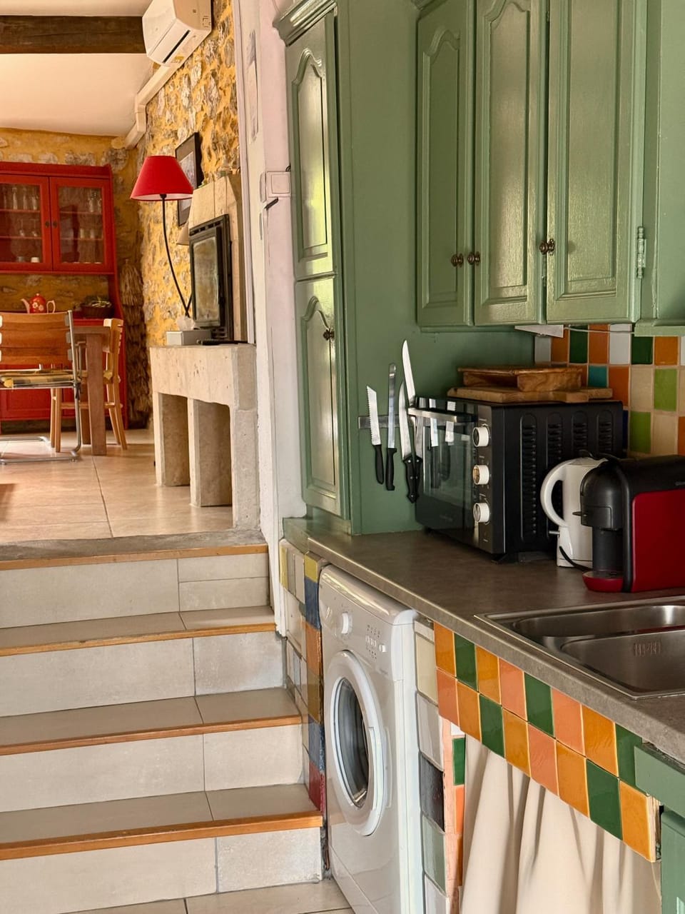 Kitchen or kitchenette, dishwasher, oven, stove, toaster, washing machine