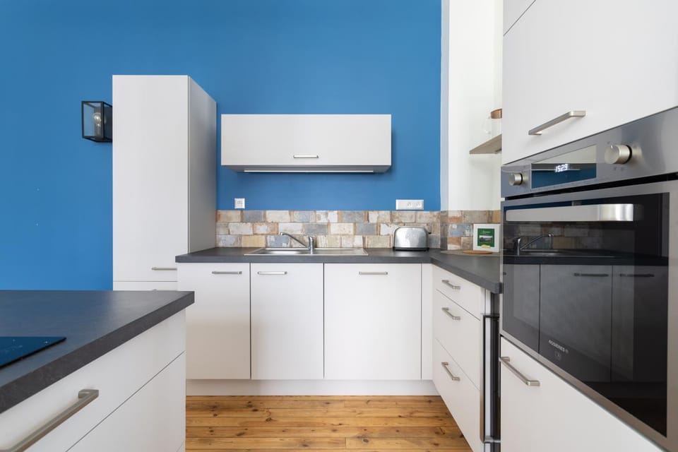 Kitchen or kitchenette, dishwasher, oven, stove