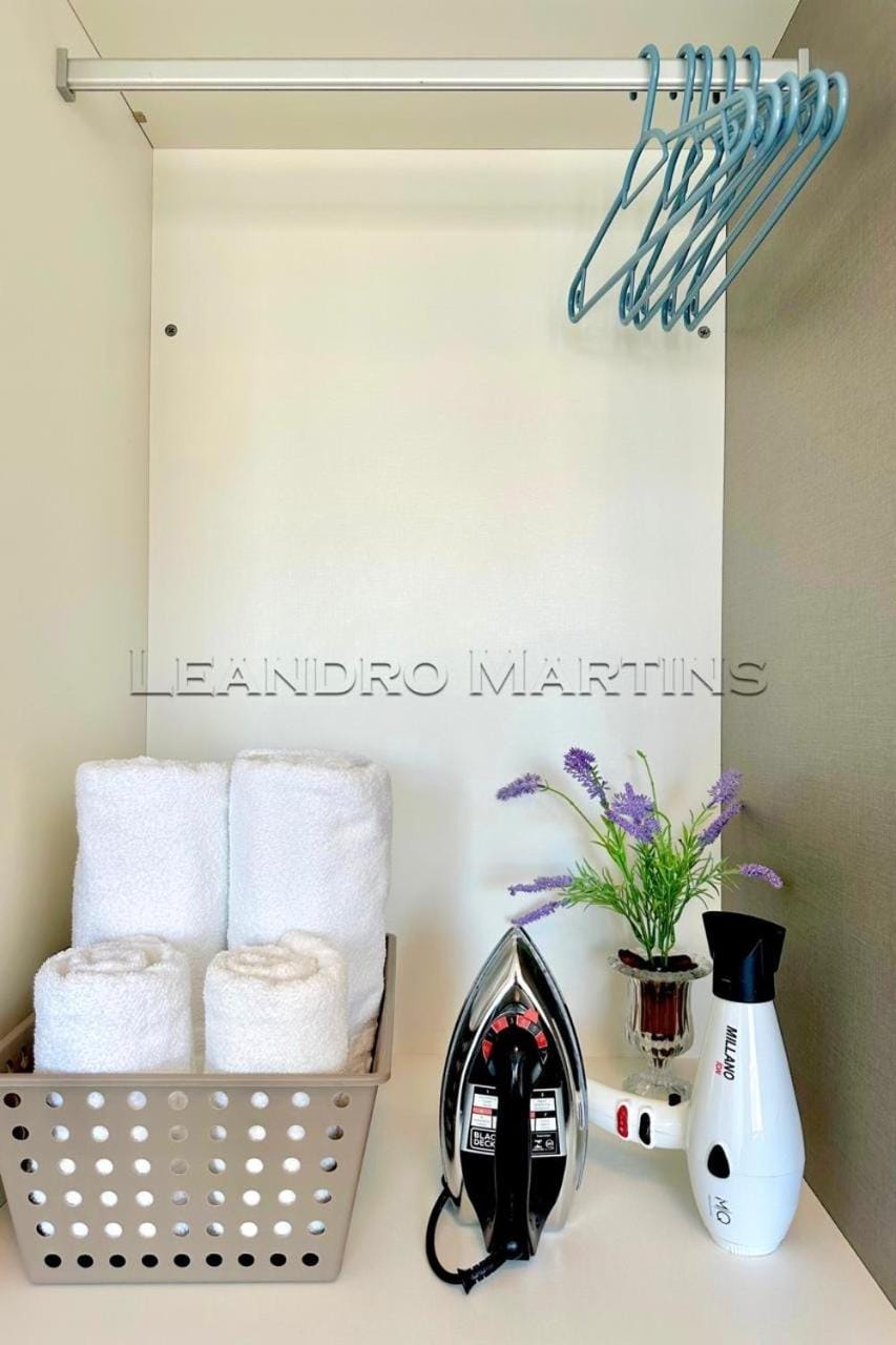 flat iron, hair dryier, towels