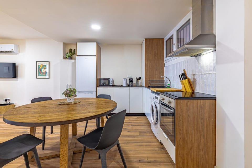 Dining area, minibar, oven, stove, washing machine, kitchen