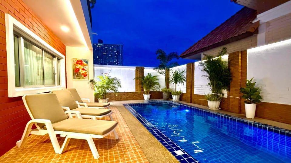 Property building, Patio, Night, Pool view, Swimming pool, sunbed
