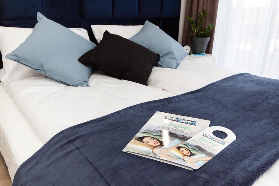 Bed, Property logo or sign, Seating area, Bedroom