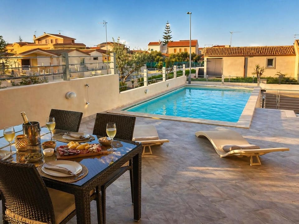 Property building, Patio, Day, Pool view, Swimming pool, sunbed