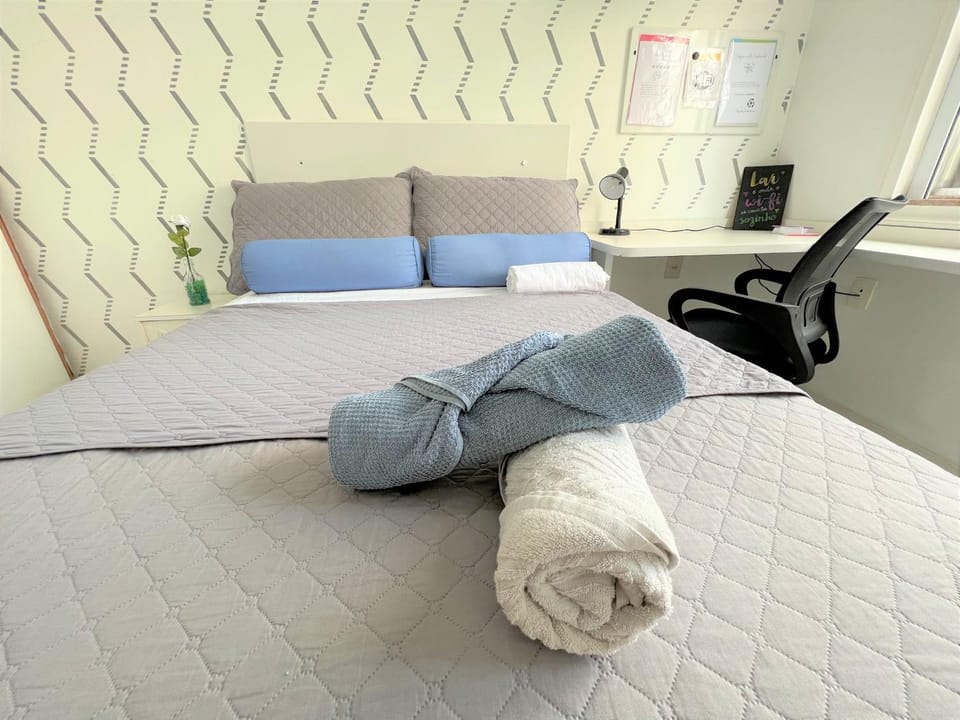 Bedroom, fireplace, microwave, towels, wardrobe, air conditioner