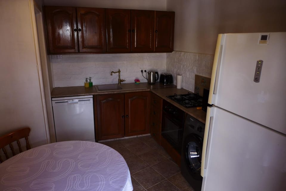 Kitchen or kitchenette, dishwasher, microwave, washing machine