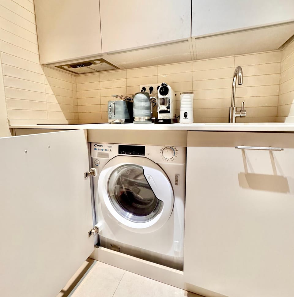 Kitchen or kitchenette, washing machine