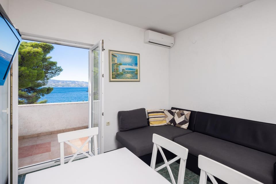 View (from property/room), Balcony/Terrace, Living room, Seating area, Sea view, air conditioner