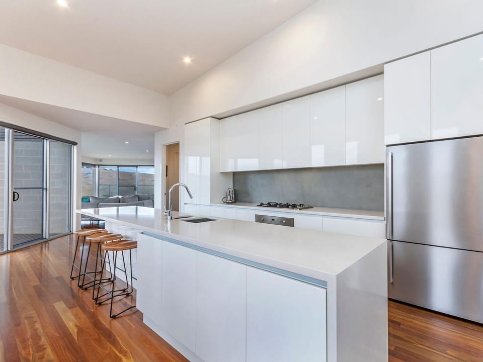 Kitchen or kitchenette, dishwasher, oven, stove