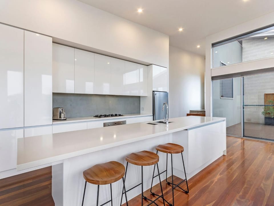 Kitchen or kitchenette, dishwasher, oven, stove