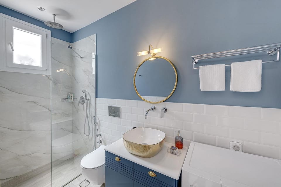 Shower, Toilet, Bathroom, hair dryier, towels, towels, washing machine