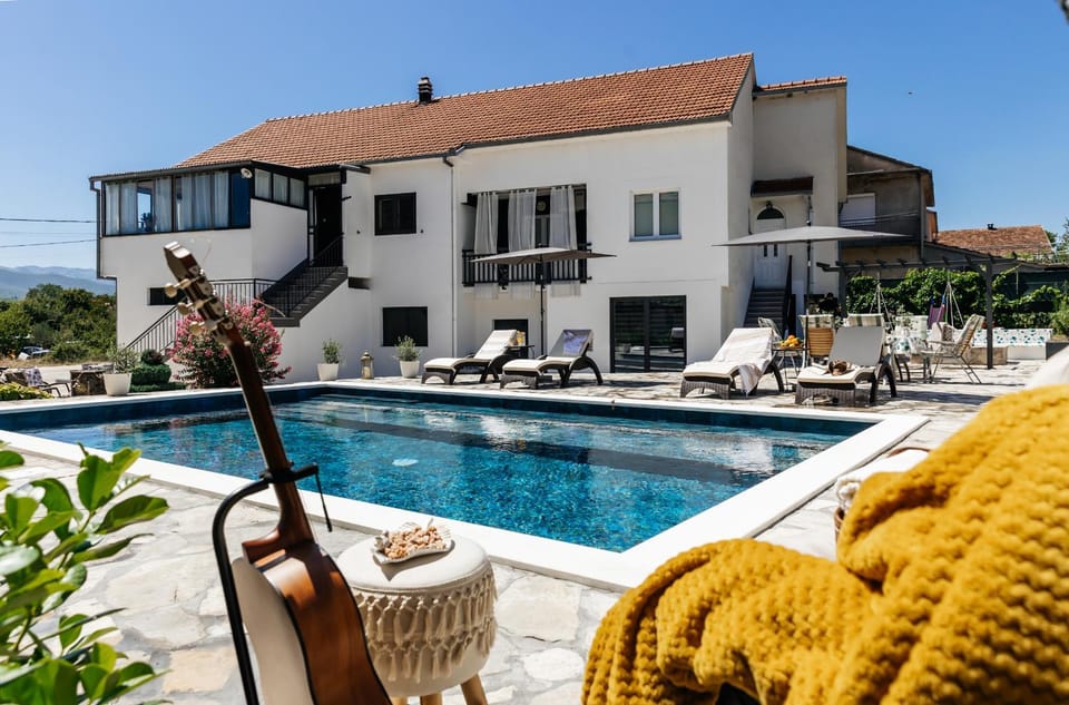Property building, Patio, Seating area, Swimming pool