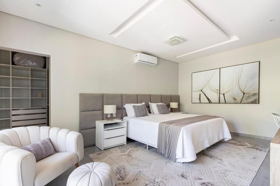 Bed, TV and multimedia, Seating area, Bedroom, air conditioner