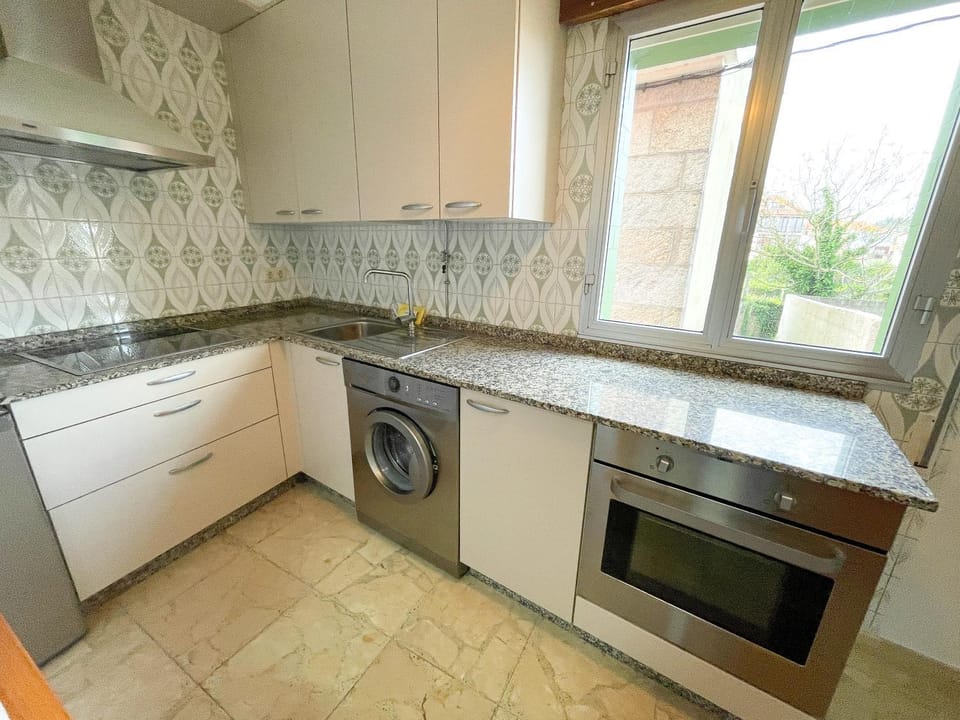 Kitchen or kitchenette, stove, washing machine