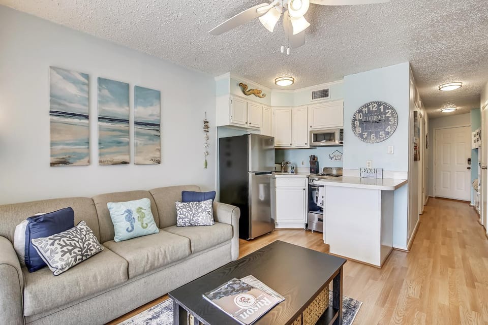 TV and multimedia, Kitchen or kitchenette, Living room, Seating area, furniture, microwave, air conditioner