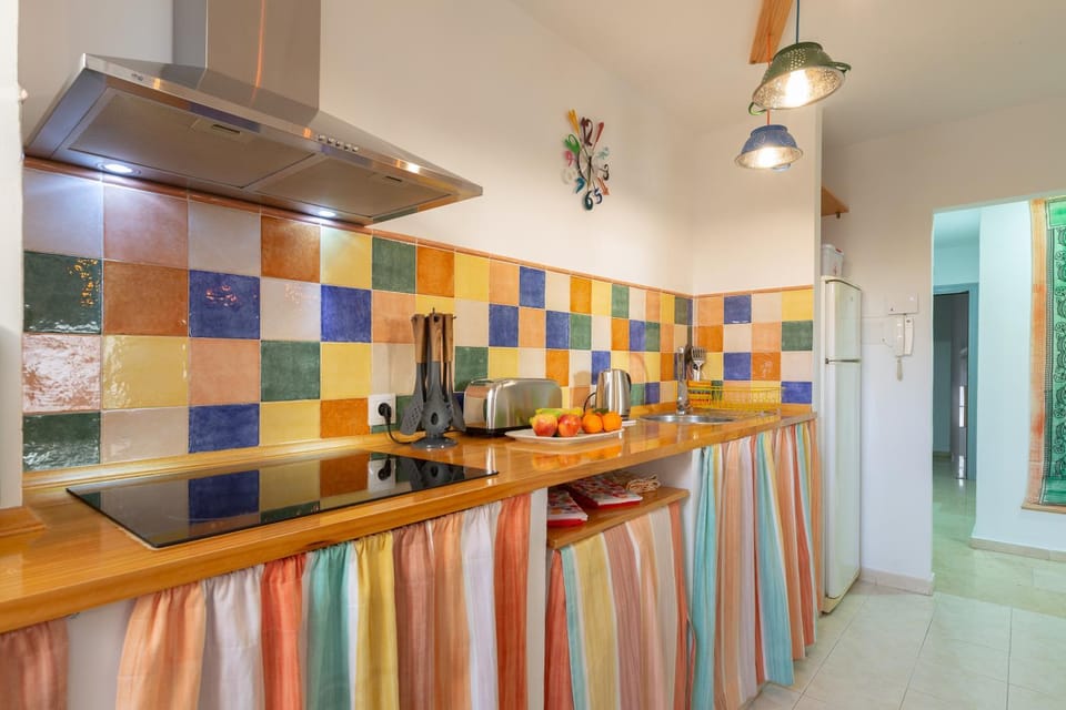Kitchen or kitchenette, furniture, minibar, stove, toaster, washing machine