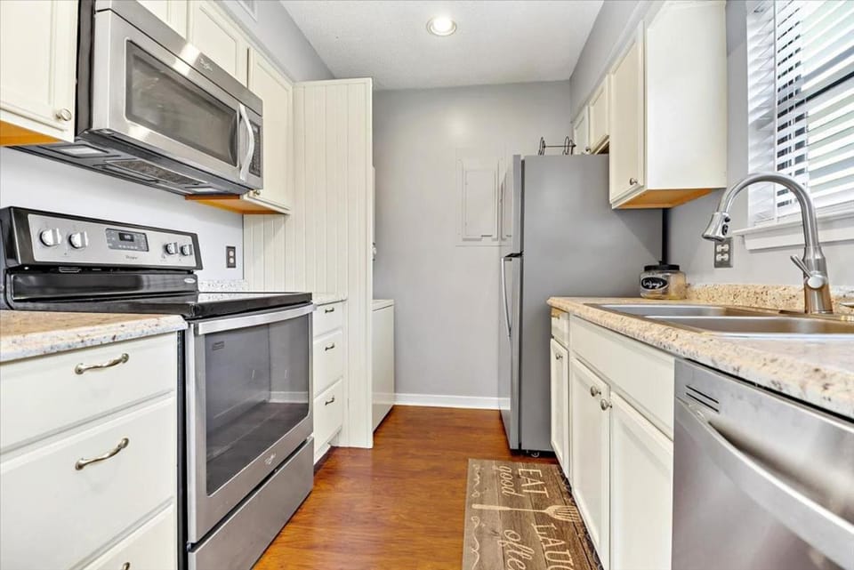 Kitchen or kitchenette, dishwasher, microwave, oven, stove, kitchen