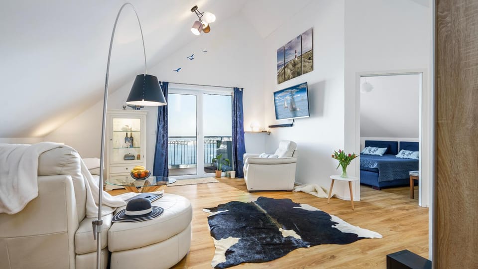View (from property/room), Living room, Seating area, Landmark view, Sunrise, Quiet street view