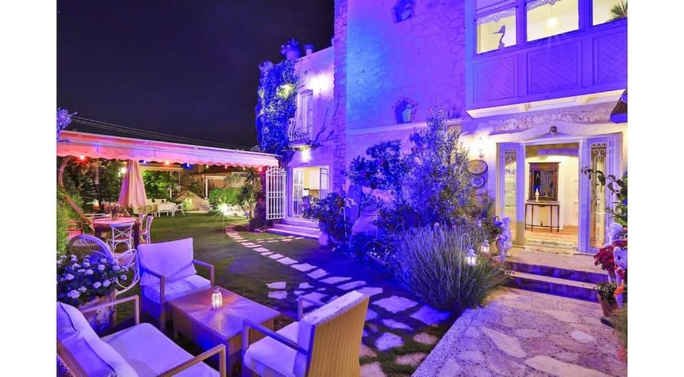 Property building, Patio, Night, Garden, Seating area