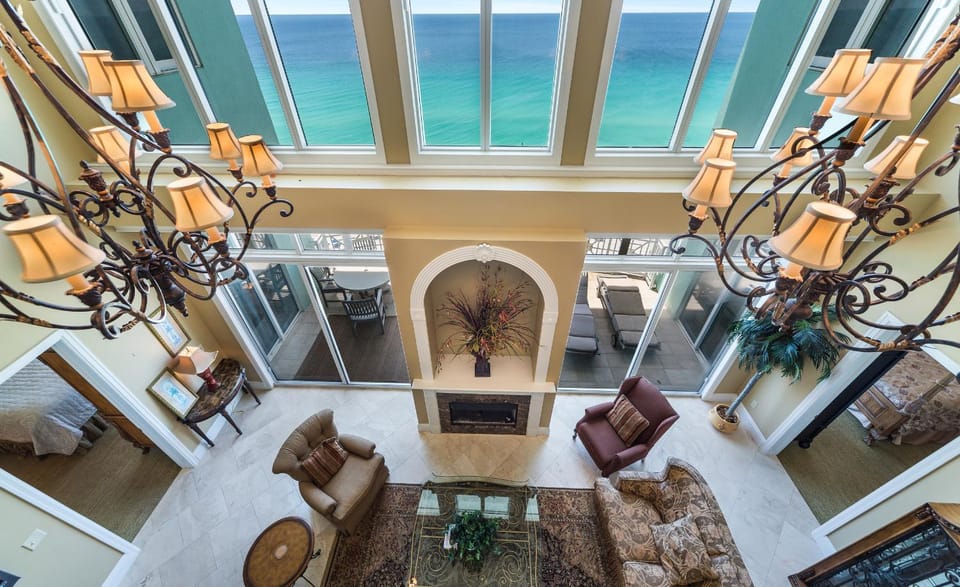 View (from property/room), Living room, Seating area, Sea view, fireplace, furniture