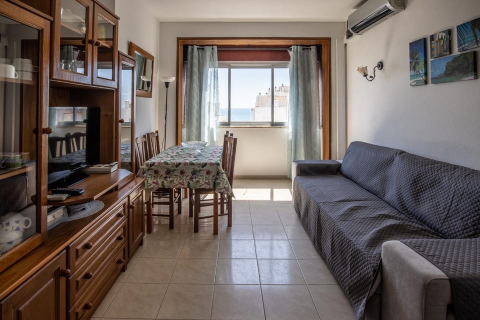 View (from property/room), Living room, Seating area, Dining area, air conditioner