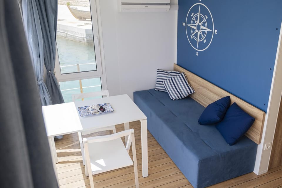 Houseboat Floatart Experience Bisceglie Docked boat in Apulia