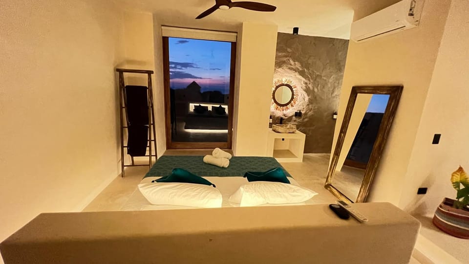 Photo of the whole room, fireplace, towels, air conditioner