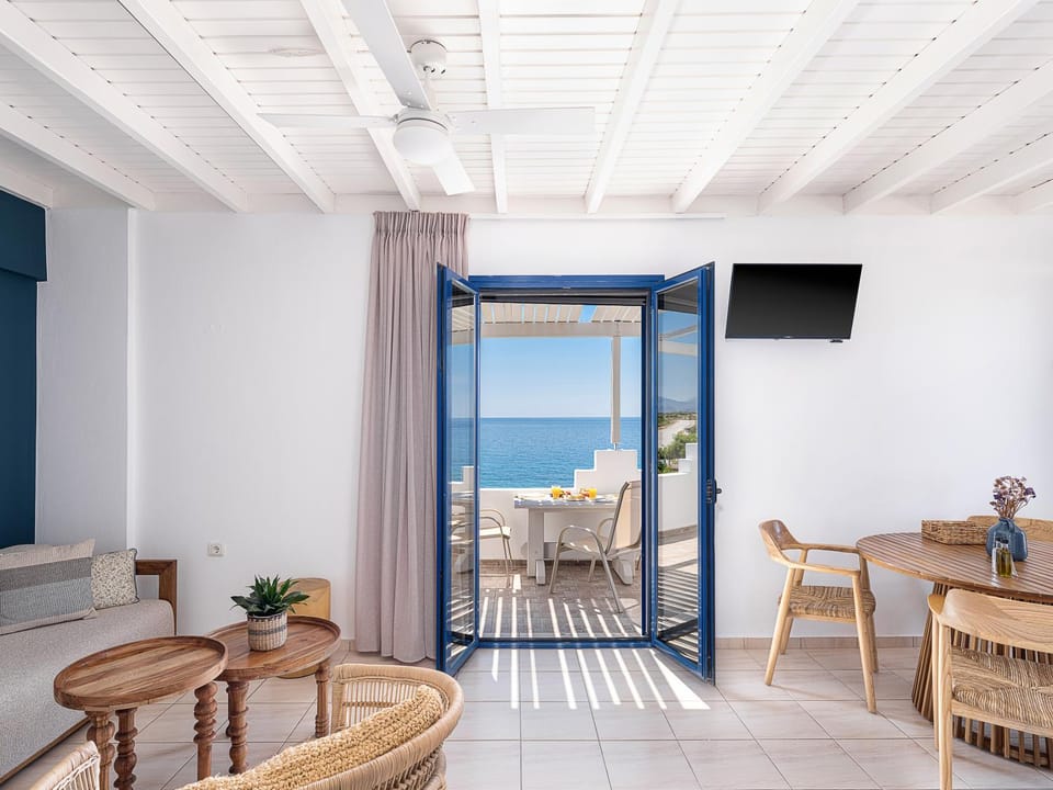 View (from property/room), Balcony/Terrace, Living room, Seating area, Dining area, Beach, Sea view