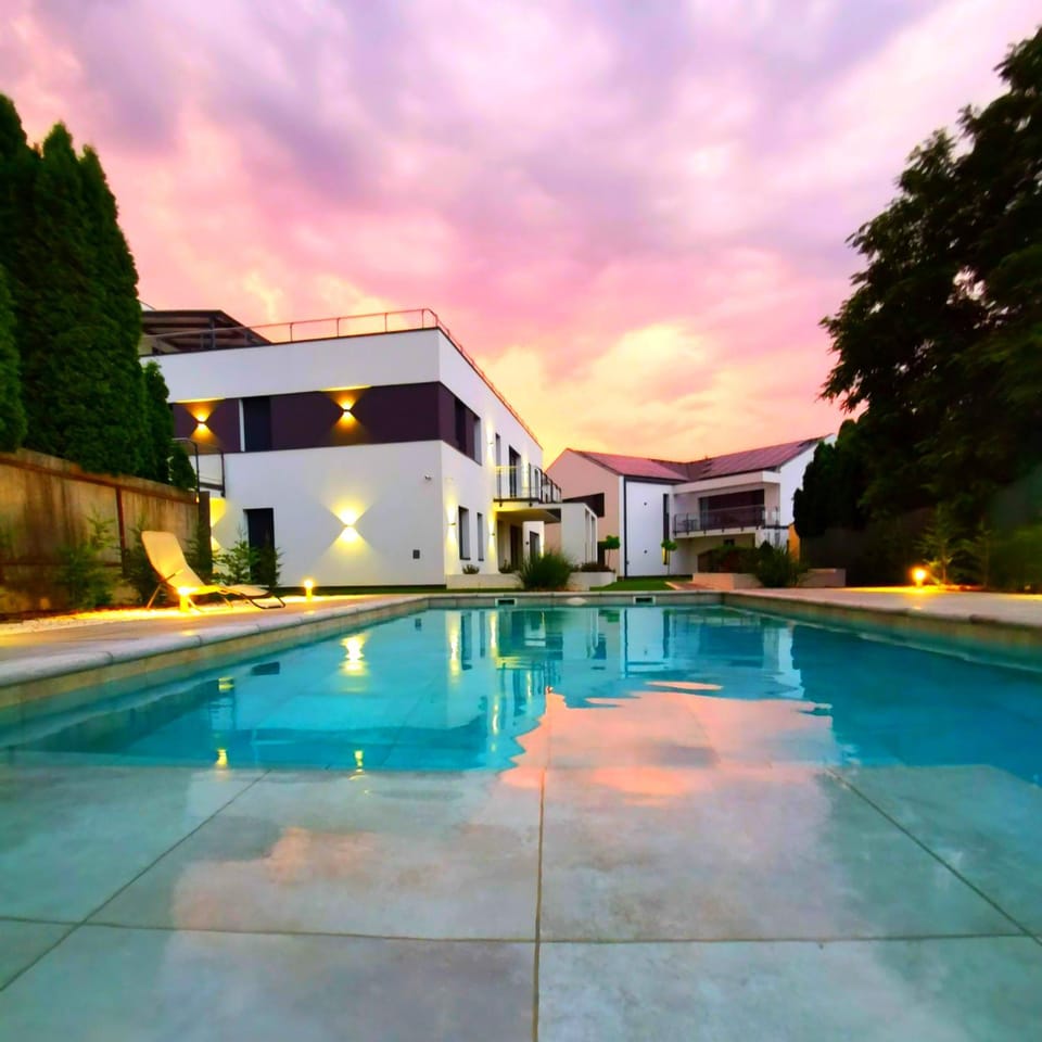 Property building, Swimming pool, Sunset
