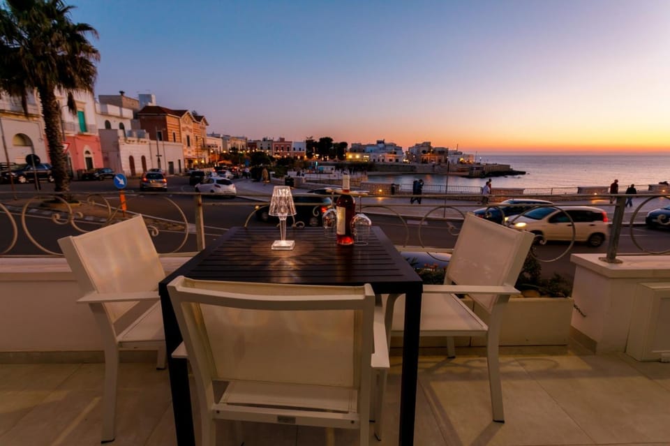 View (from property/room), Balcony/Terrace, Beach, City view, Sea view, Sunset