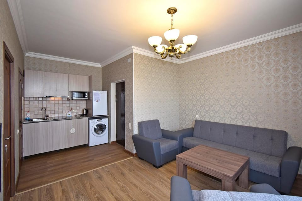 Coffee/tea facilities, Kitchen or kitchenette, Seating area, oven, washing machine