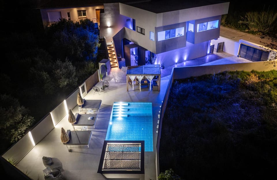 Property building, Patio, Night, Pool view, Swimming pool, sunbed