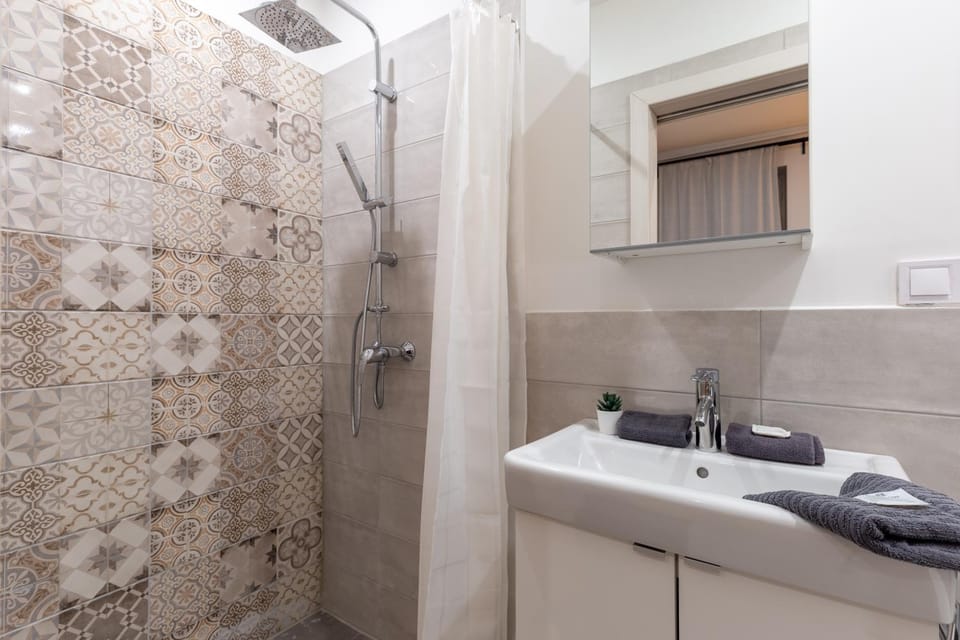 Shower, Toilet, Bathroom, hair dryier, towels
