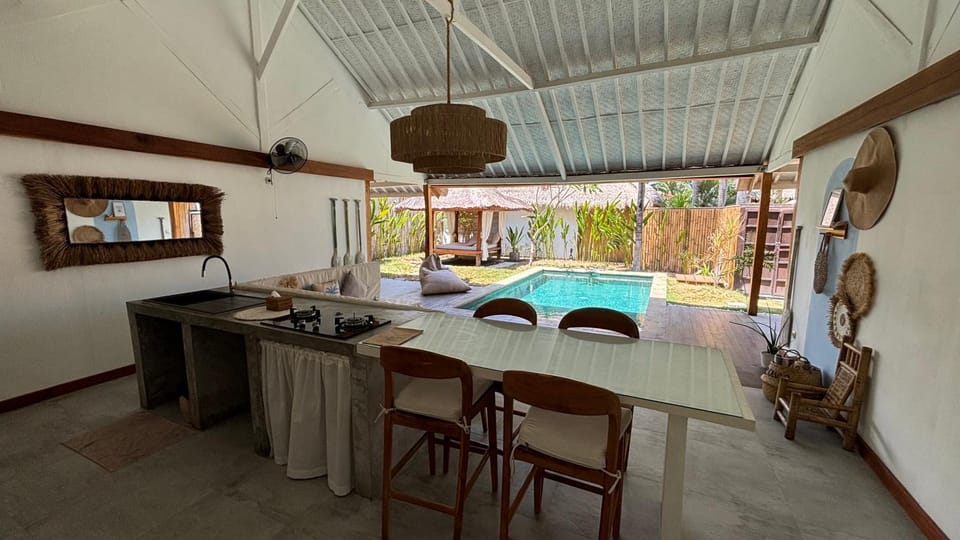 View (from property/room), Living room, Seating area, Dining area, Garden view, Pool view, Swimming pool, kitchen