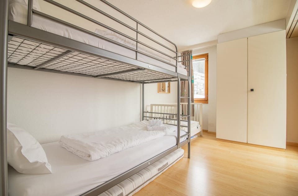 Bed, Photo of the whole room, Bedroom, bunk bed, towels, wardrobe