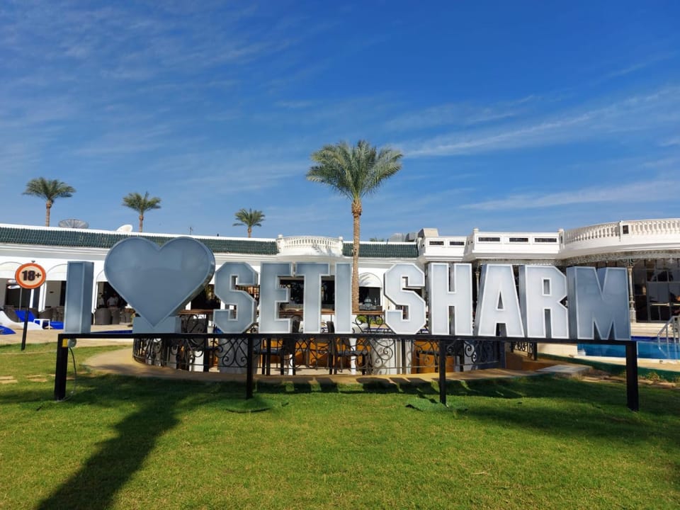 Property building, Restaurant/places to eat, Property logo or sign, Swimming pool