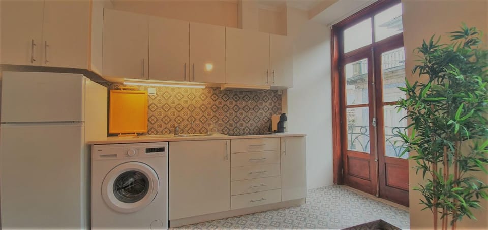 Kitchen or kitchenette, washing machine