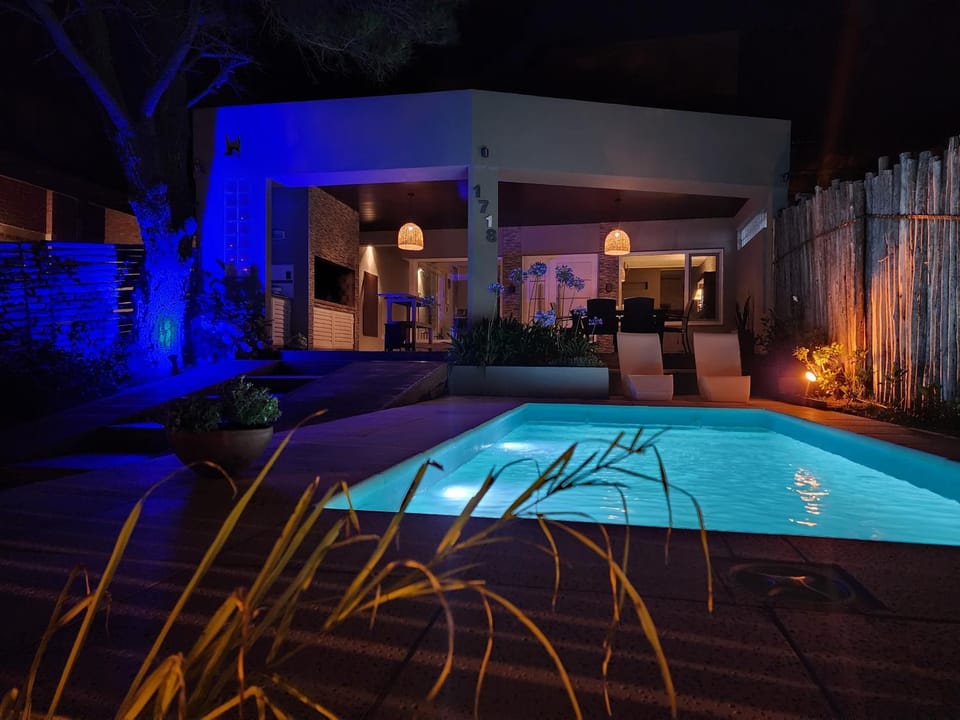 Property building, Facade/entrance, Night, Pool view, Swimming pool, sunbed