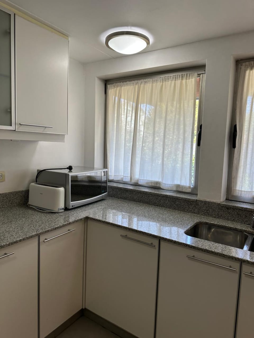Kitchen or kitchenette, microwave, toaster