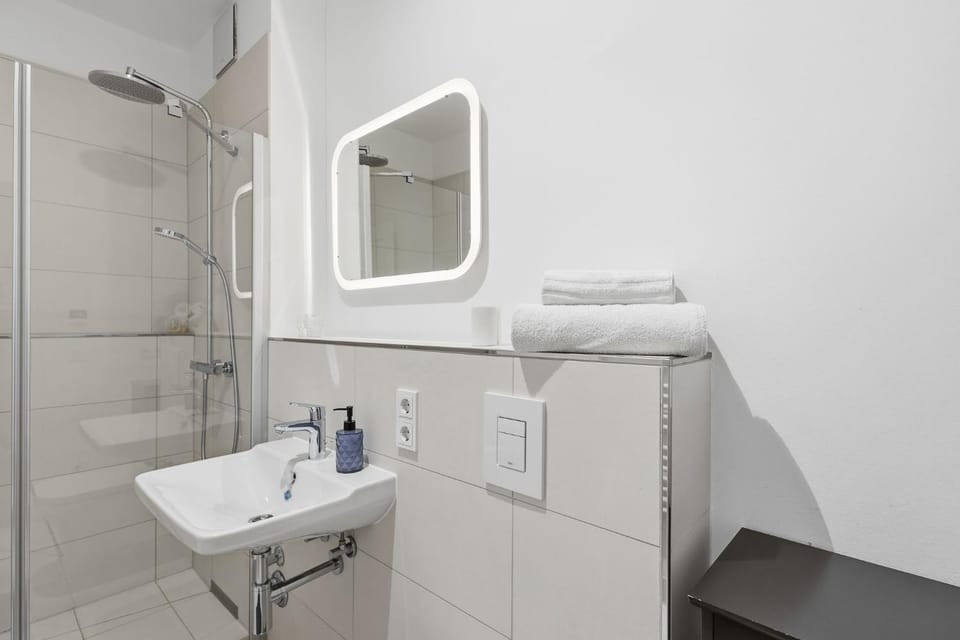 Shower, Toilet, Bathroom, hair dryier, towels