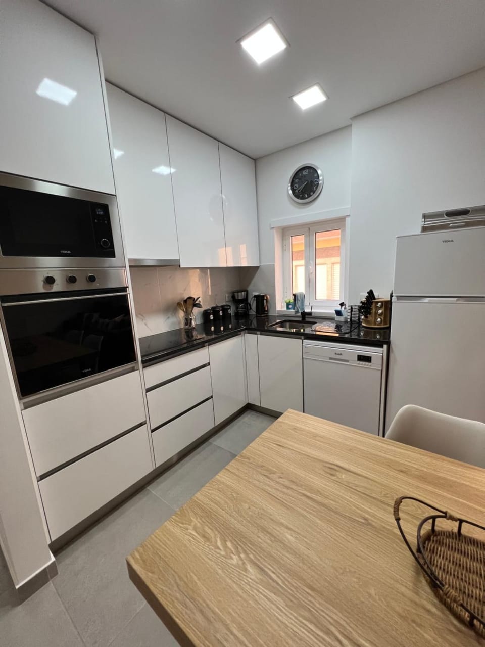 Kitchen or kitchenette, dishwasher, oven, stove