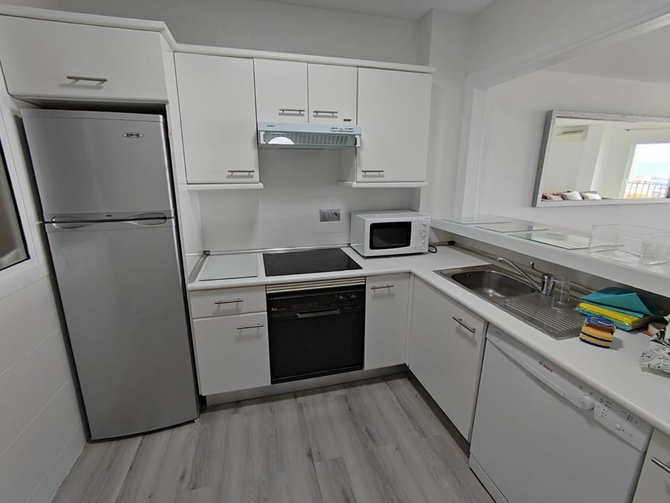 Kitchen or kitchenette, dishwasher, oven, stove, toaster