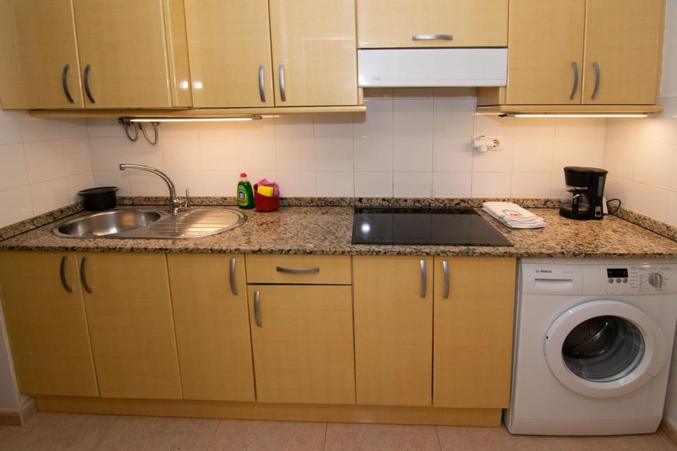 Kitchen or kitchenette, washing machine